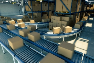 distribution warehouse packages on a conveyor